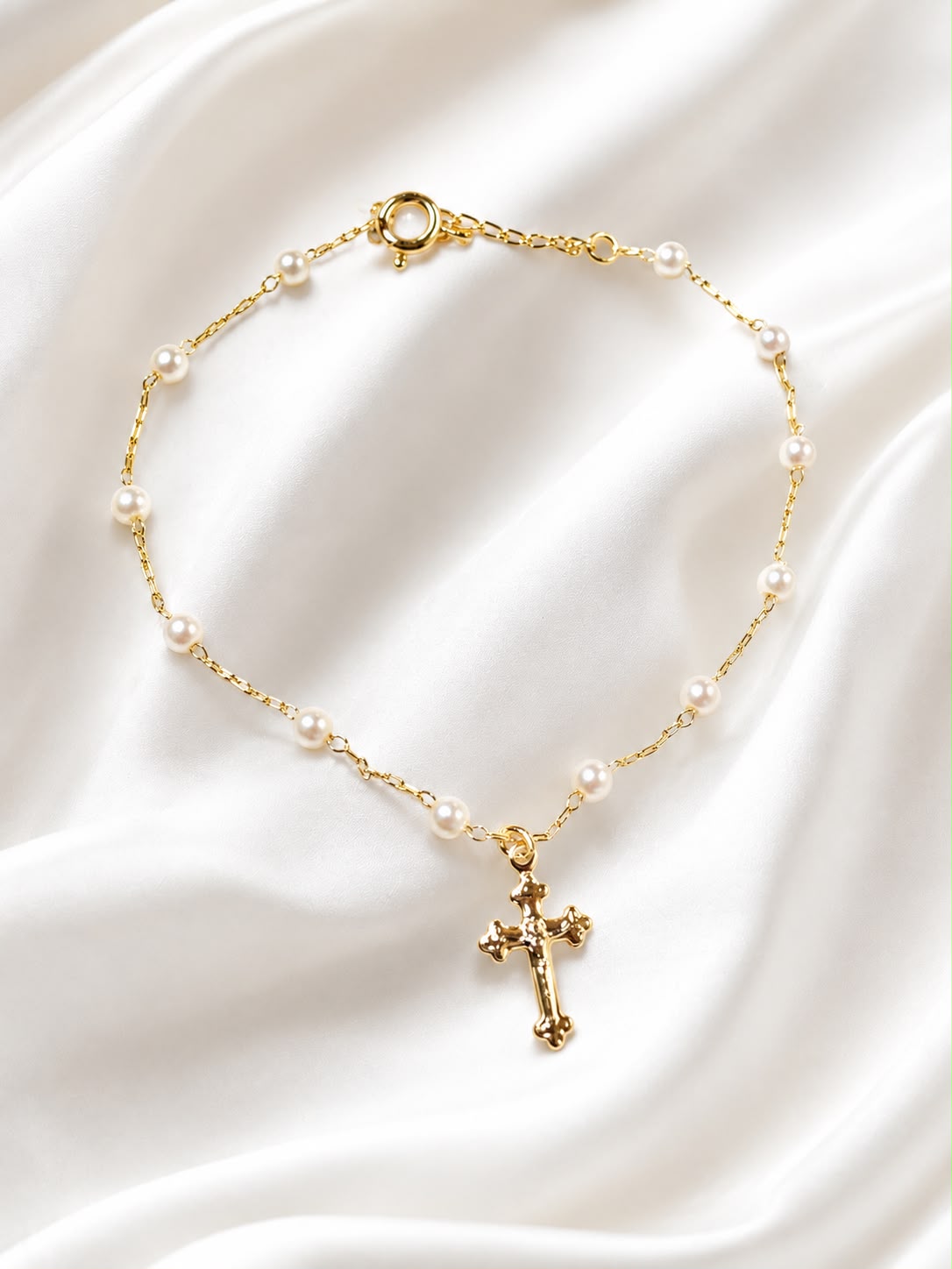 Perlas y cruz
